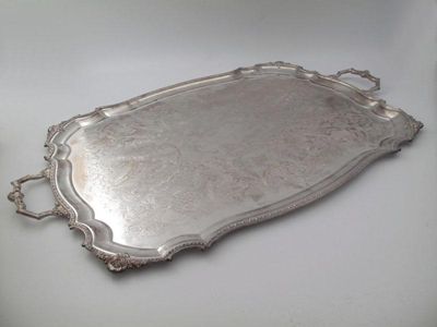 Appraisal: A modern electroplated two-handled tray by Poston Products Limited shaped