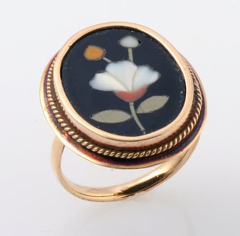 Appraisal: KY Ring X mm oval Floral motif of semi-precious stone