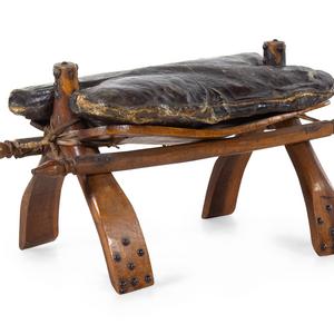 Appraisal: A Camel Saddle th Century with a leather pillow Width