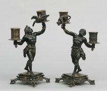 Appraisal: Bronze Blackamoor Candlesticks Circa Bronze figurative candelabra raised on squared