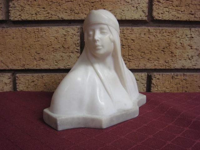 Appraisal: A alabaster Bust of a lady wearing a headdress signed