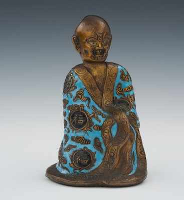 Appraisal: An Enameled Luohan Chinese Bronze hollow cast with applied blue