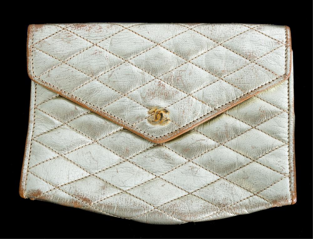 Appraisal: VINTAGE CHANEL QUILTED METALLIC GOLD CLUTCHVintage Chanel quilted metallic gold