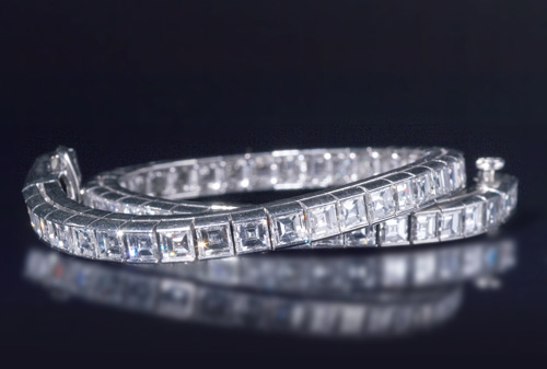 Appraisal: Diamond line bracelet in pt Fifty-nine square step-cut diamonds cts