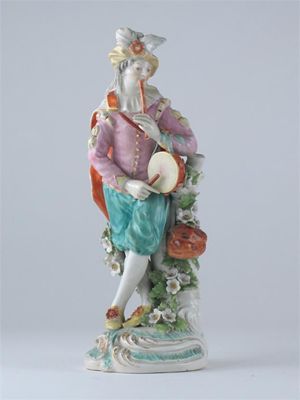 Appraisal: A Derby model of a musician playing a tambourine and