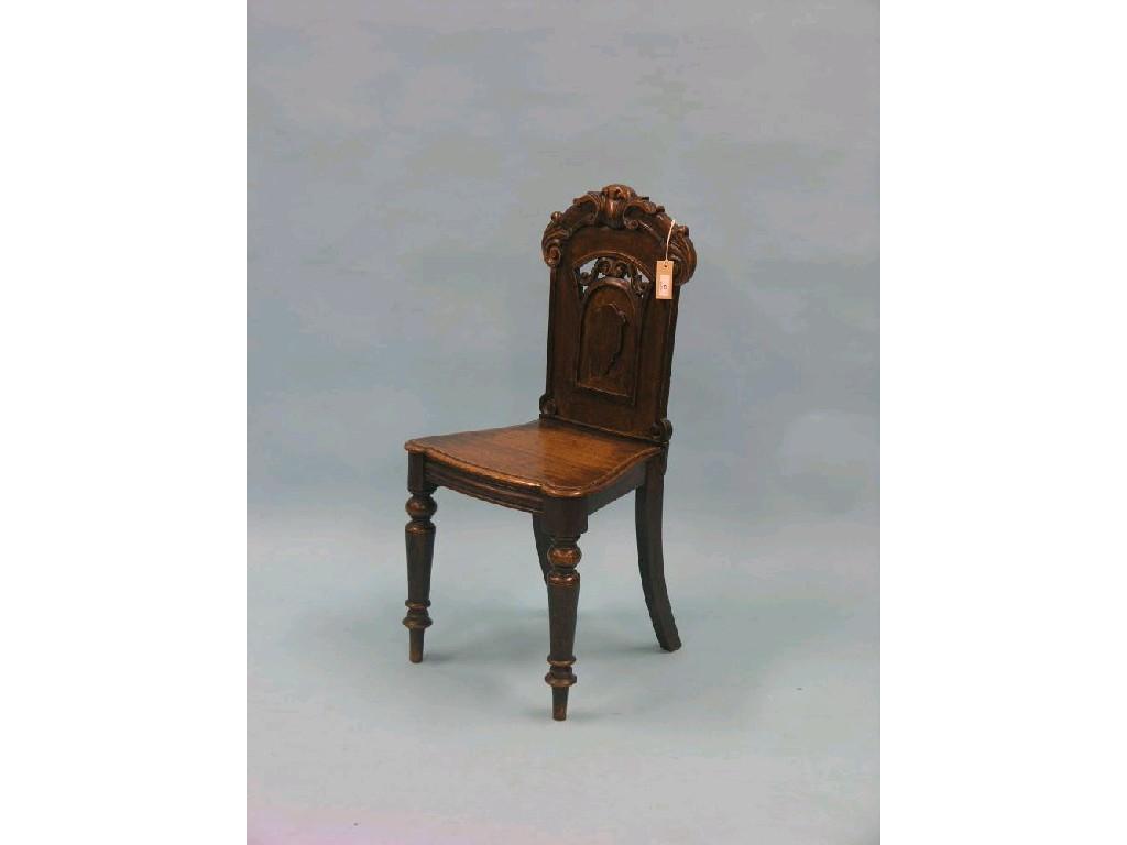 Appraisal: A Victorian oak hall chair with carved and pierced back