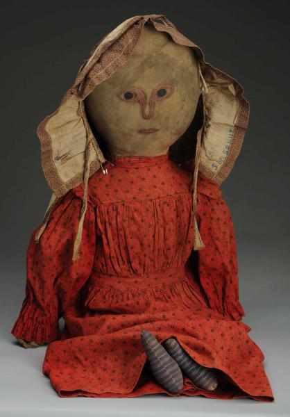 Appraisal: Primitive Cloth Doll Simply painted face with round black eyes