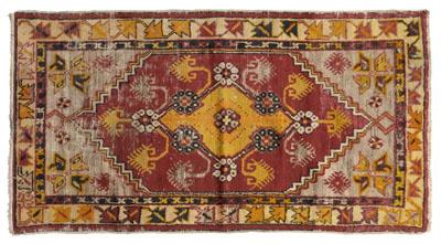 Appraisal: Turkish rug gold central medallion with pendant on brick red