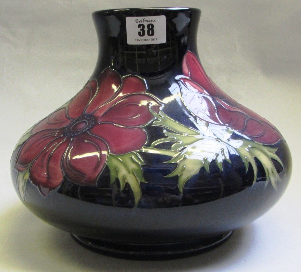 Appraisal: A Moorcroft pottery vase decorated with anenome against a dark