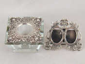 Appraisal: A double miniature photo frame marked sterling and a cut