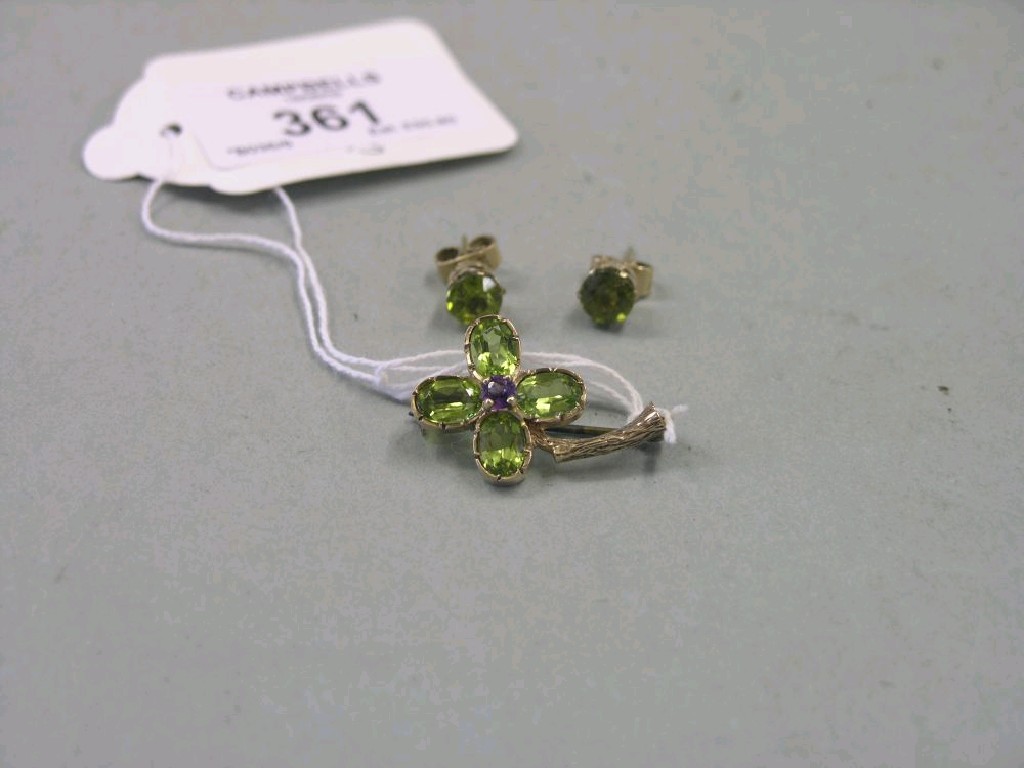 Appraisal: A ct gold peridot and amethyst brooch in the form