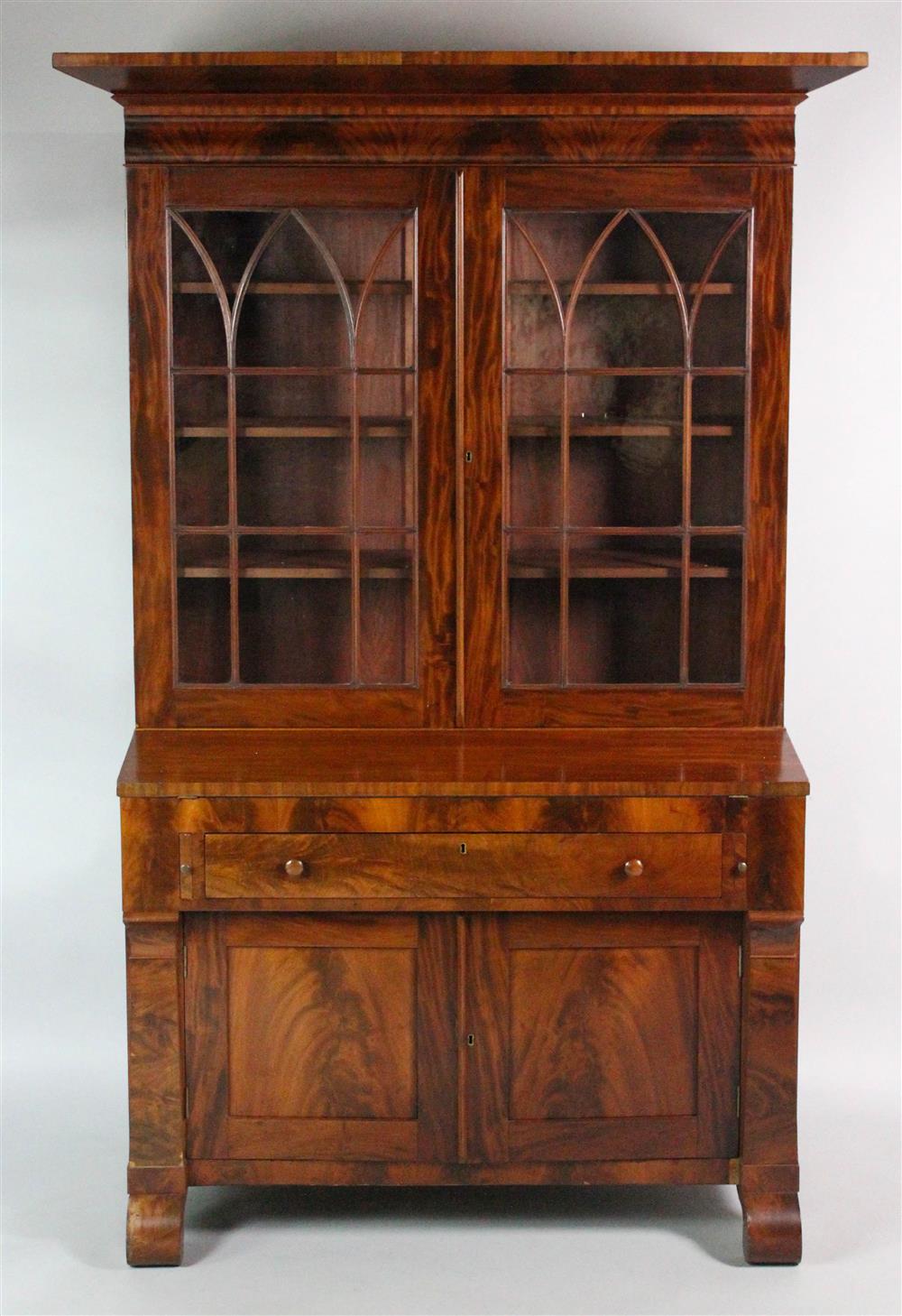 Appraisal: AMERICAN EMPIRE MAHOGANY SECRETARY BOOKCASE in two parts the upper