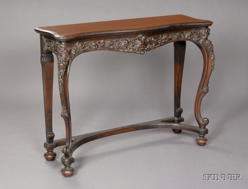 Appraisal: Rococo Revival Carved Mahogany Console Table th century serpentine top