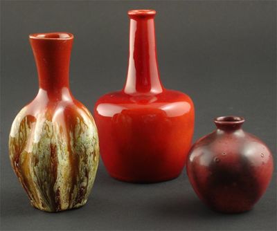 Appraisal: A Bretby pottery gourd vase covered with a running red