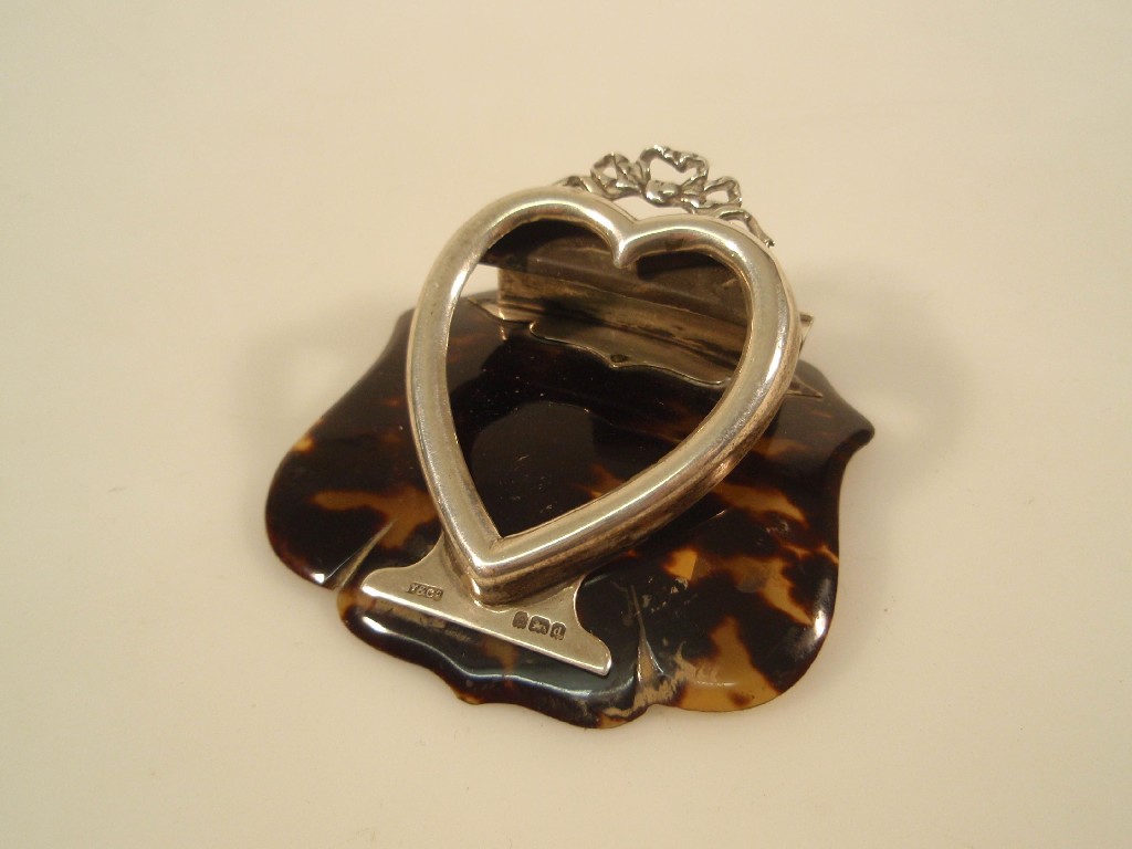 Appraisal: An Edward VII tortoiseshell and silver desk clip with a