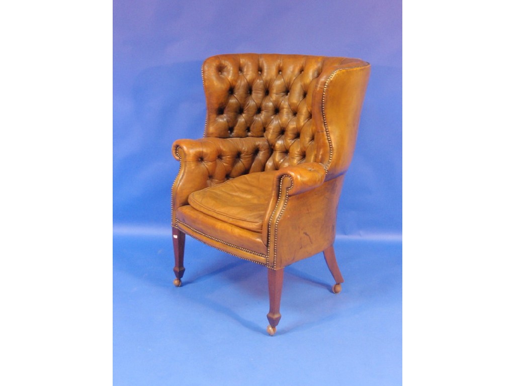 Appraisal: A mid thC mahogany framed wing back tub chair upholstered