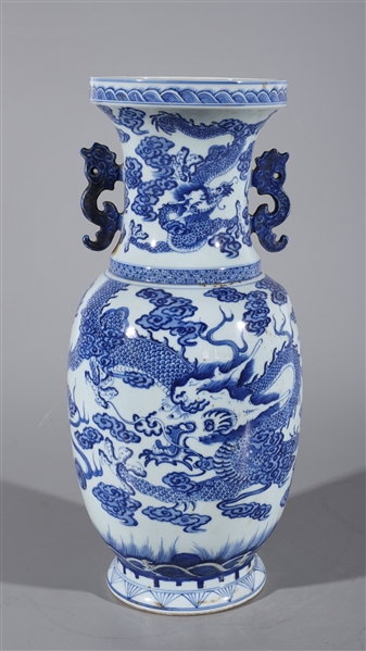 Appraisal: Chinese blue and white vase with model handles dragon chasing