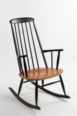 Appraisal: Style of Ilmair Tapiovaara a rocking chair with ebonised spindle