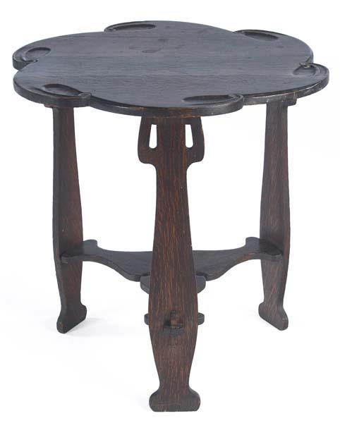 Appraisal: CHARLES ROHLFS Carved tea table with a floriform top over