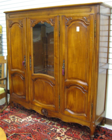 Appraisal: PROVINCIAL STYLE MAHOGANY CABINET BOOKCASE French th century having three