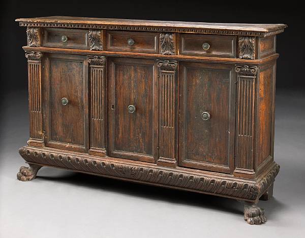 Appraisal: An Italian Baroque walnut credenza incorporating antique elements The rectangular