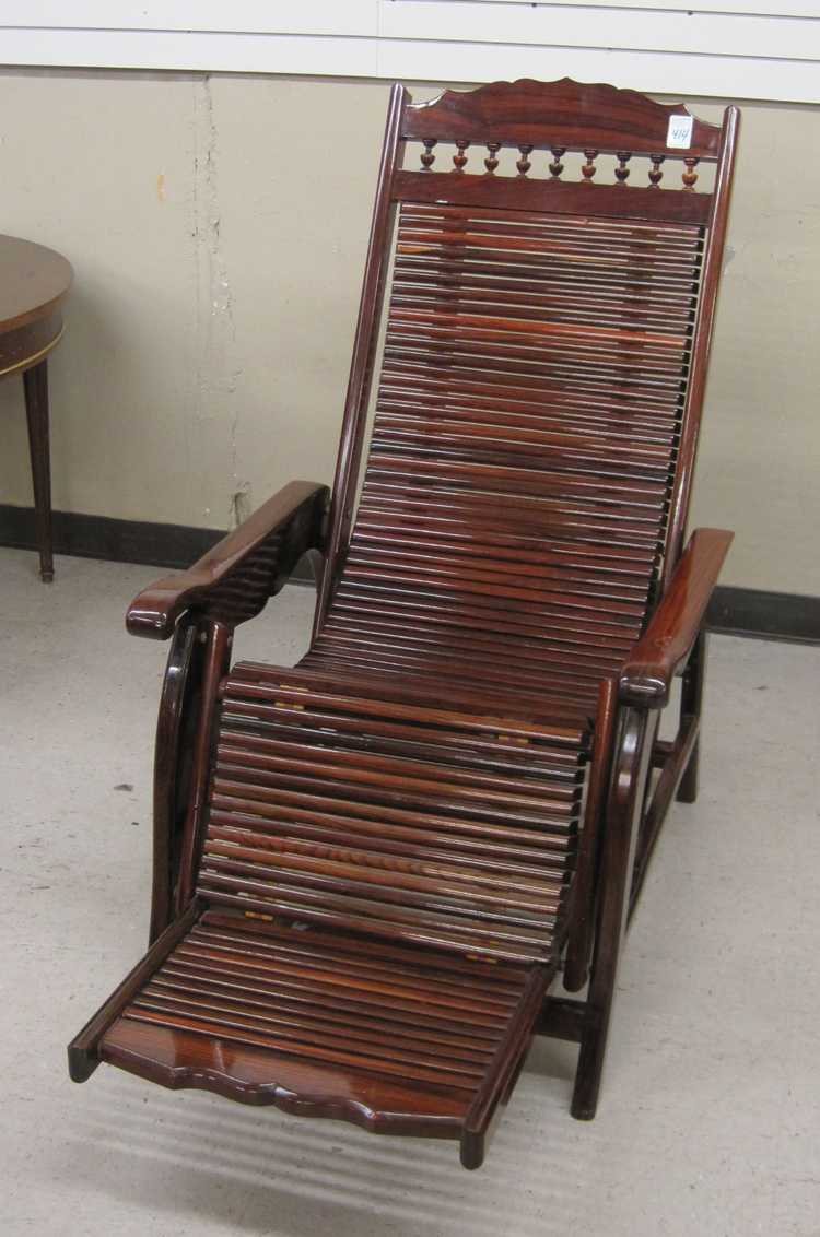 Appraisal: A BRAZILIAN ROSEWOOD LOUNGE CHAIR mid- th century design a