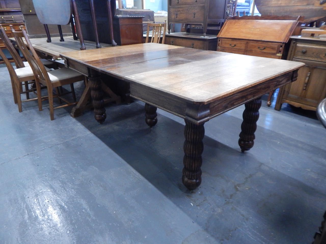 Appraisal: A Victorian oak extending dining table the rectangular top with