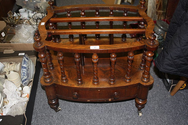 Appraisal: A VICTORIAN WALNUT OVAL CANTERBURY with spindle supports cm