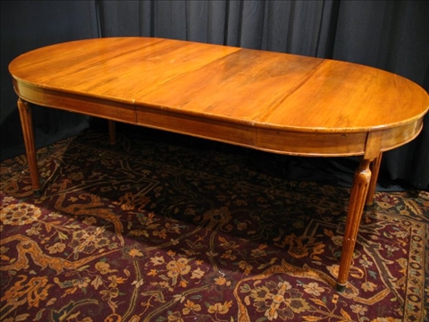 Appraisal: LOUIS XVI STYLE WALNUT DINING TABLE th century the rounded