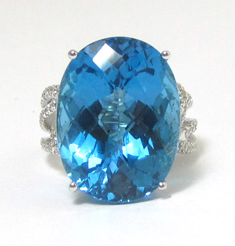 Appraisal: BLUE TOPAZ AND EIGHTEEN KARAT WHITE GOLD RING with round-cut