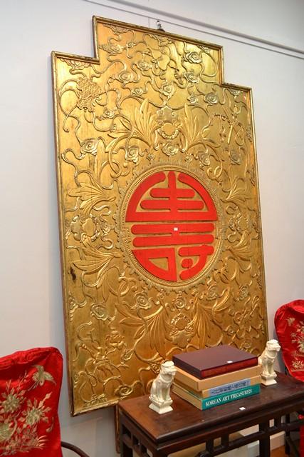 Appraisal: IMPRESSIVE CHINESE CARVED AND GILDED WALL PLAQUE WITH CENTRAL RED