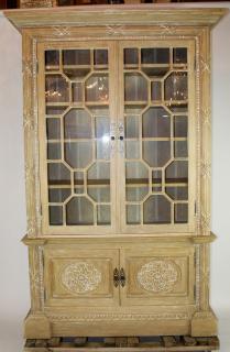 Appraisal: Bleached oak bookcase with geometric glazed upper doors over cabinet