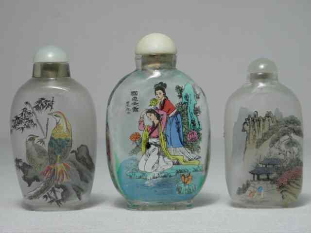 Appraisal: Three th century Chinese inside-painted glass snuff bottles Carved stone