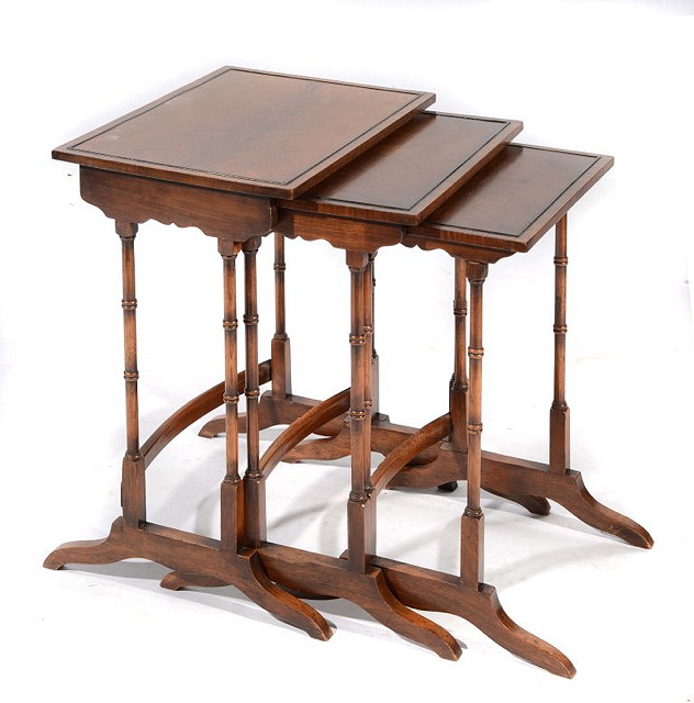 Appraisal: A MAHOGANY NEST OF TABLES comprising three tables each on