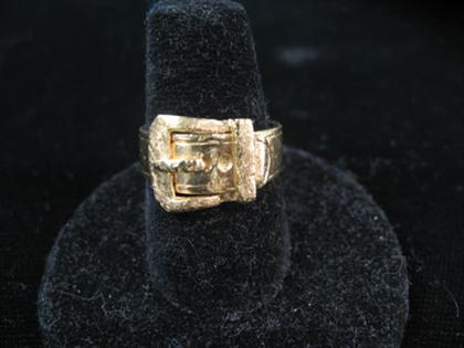 Appraisal: karat yellow gold buckle ring Smooth and textured gold in