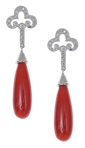 Appraisal: A PAIR OF CORAL AND DIAMOND DROP EARRINGS The elongated