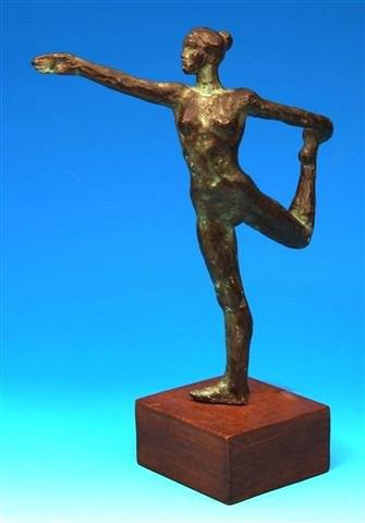 Appraisal: A bronze sculpture of a female dancer standing on a