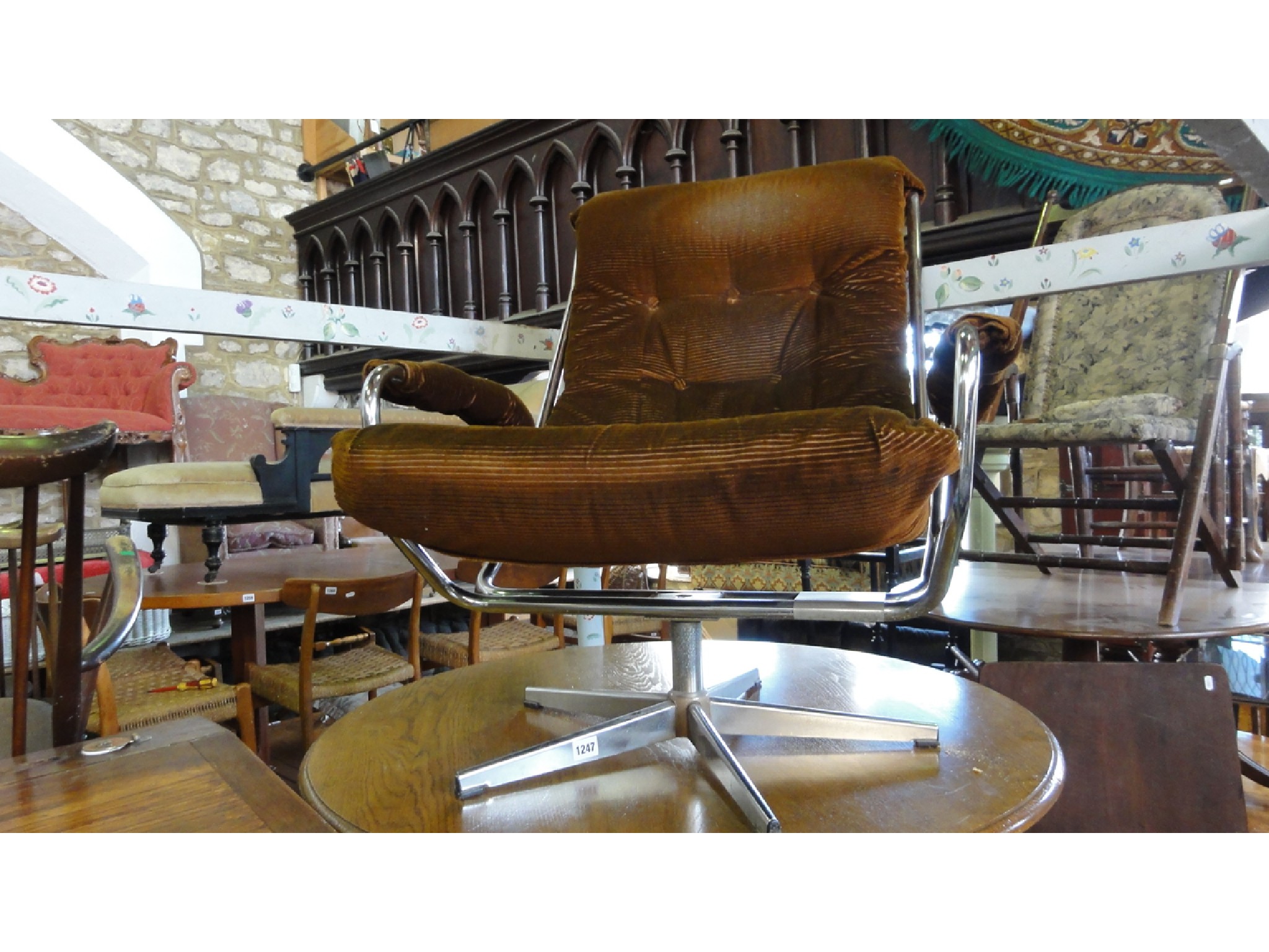 Appraisal: A 's swivel lounge chair with brown corduroy seat within