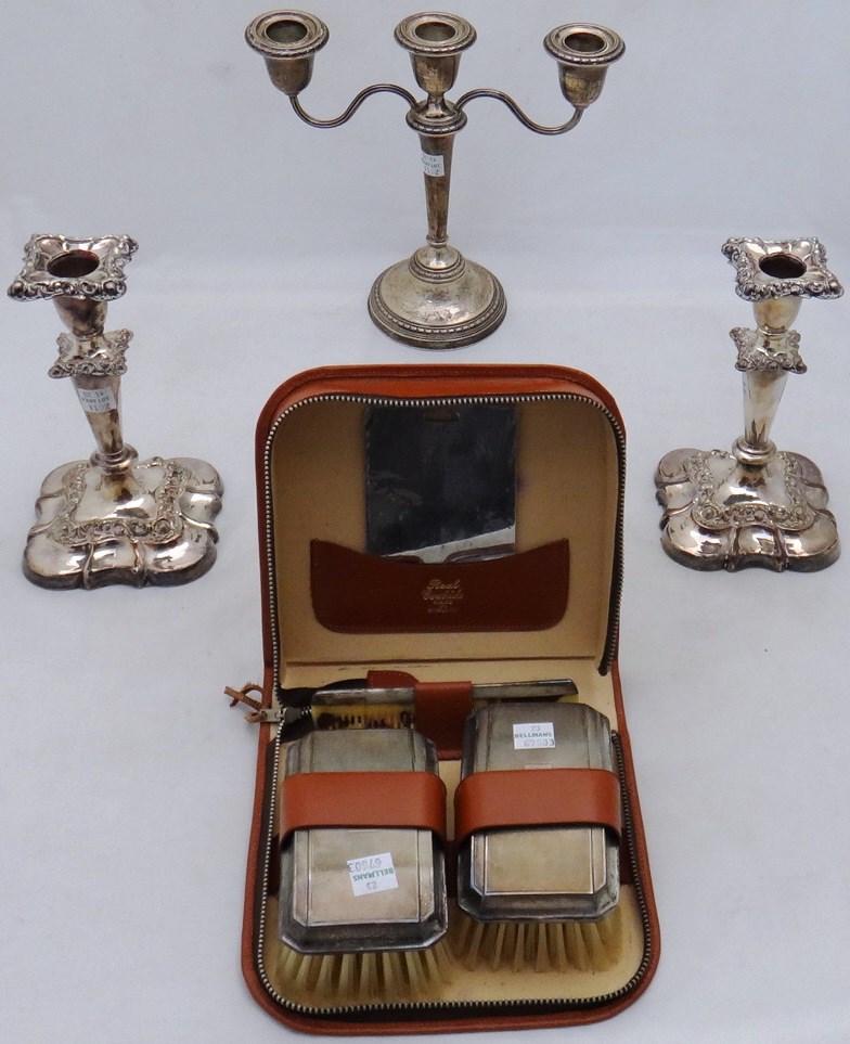 Appraisal: A travelling dressing set comprising a pair of silver mounted