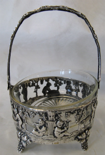 Appraisal: GERMAN FINE SILVER CANDY DISH footed basket form with putti