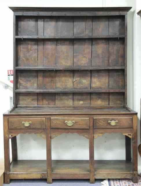 Appraisal: An th Century oak dresser fitted three drawers to the