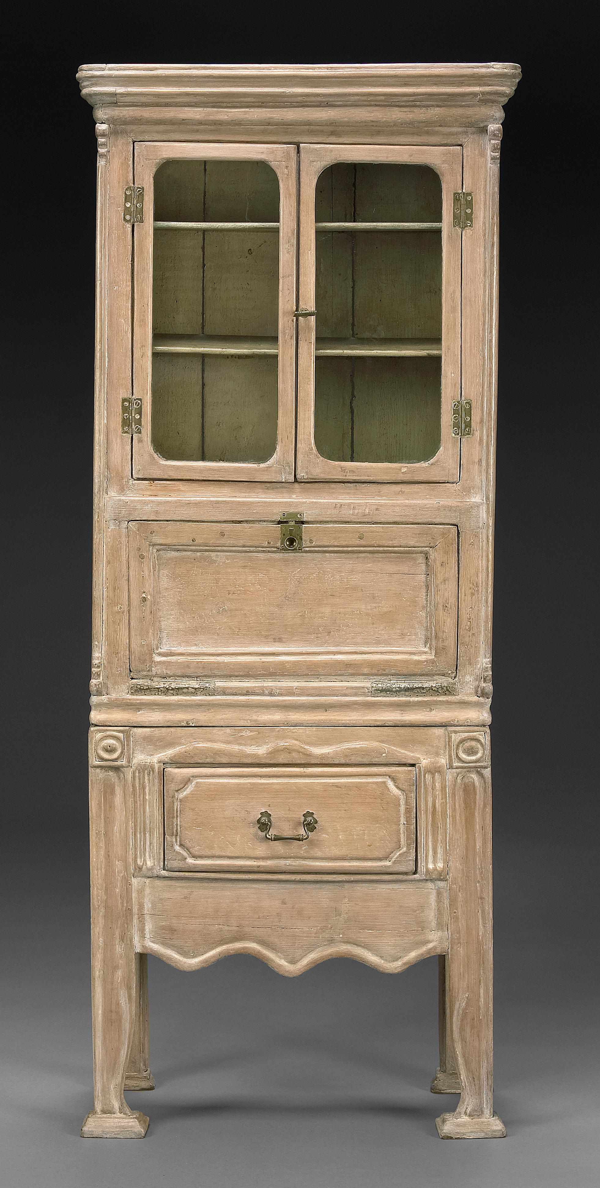 Appraisal: A Provincial style limed pine secretary cabinet height in width