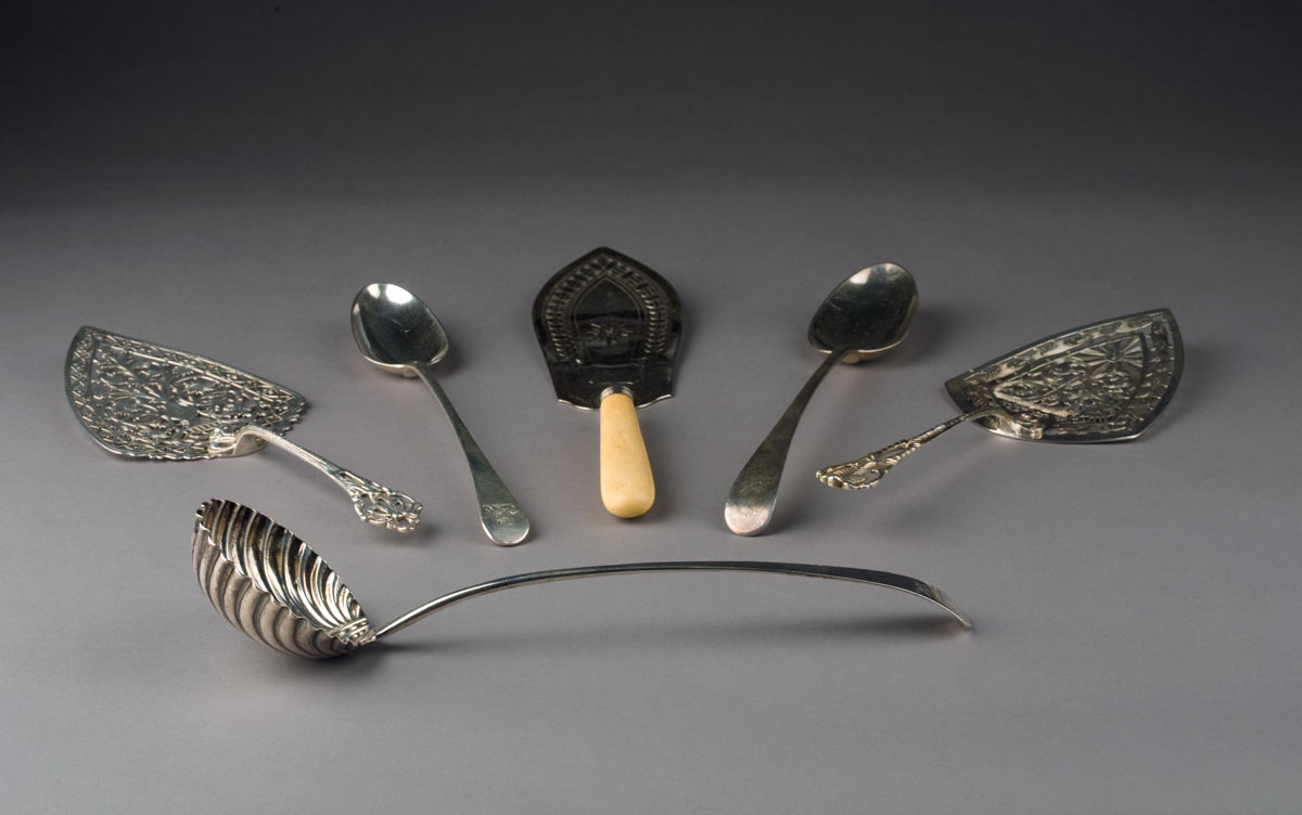 Appraisal: GEORGE III SILVER PUNCH LADLE AND A DRESSING SPOON HESTER