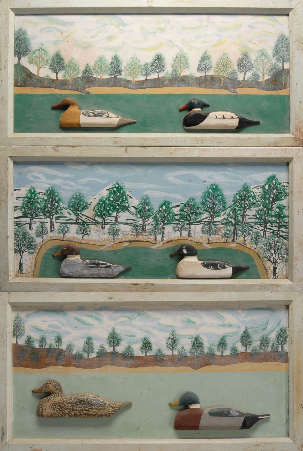 Appraisal: THREE CARVED AND PAINTED WOODEN PLAQUES By Harold A Davis