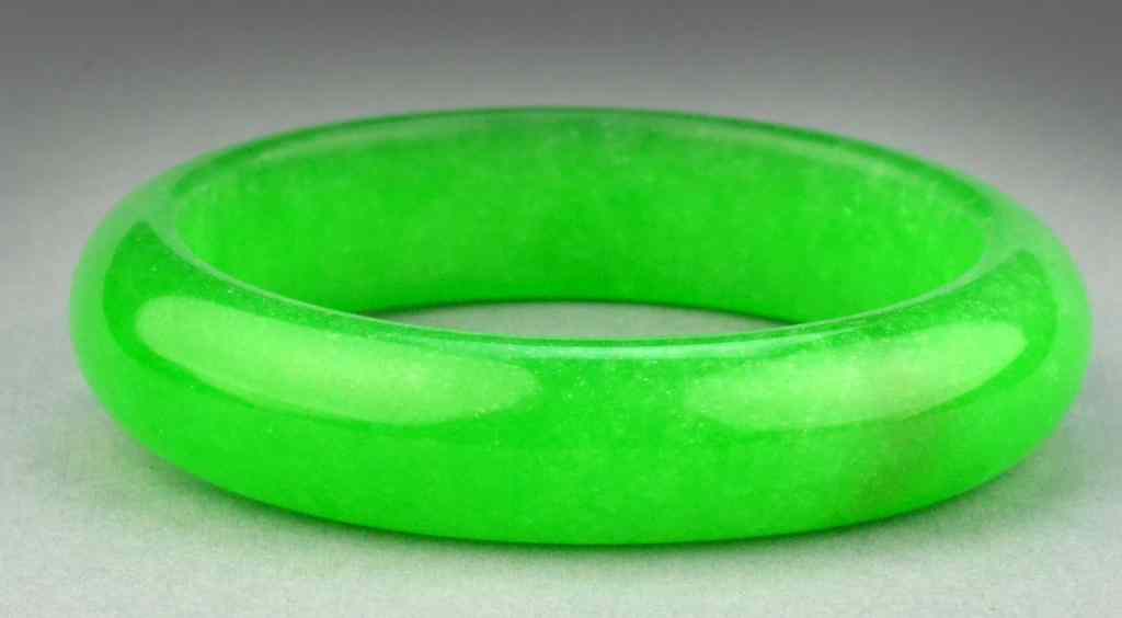 Appraisal: Chinese Apple Green Jadeite Bangle BraceletThe stone a nice apple