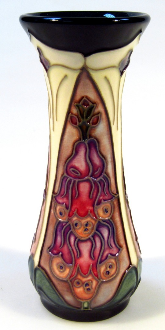 Appraisal: A Moorcroft pottery Foxglove Amberswood pattern vase of inverted circular