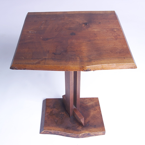 Appraisal: JAMES MARTIN Walnut pedestal side table with free-edge top and