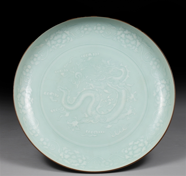 Appraisal: Chinese Qingbai glazed porcelain dish with writhing dragon chasing flaming