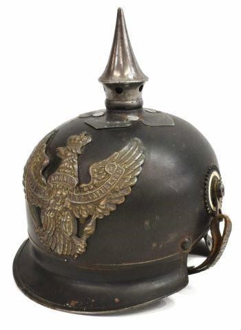 Appraisal: German pickelhaube helmet fitted with metal front plate depicting the