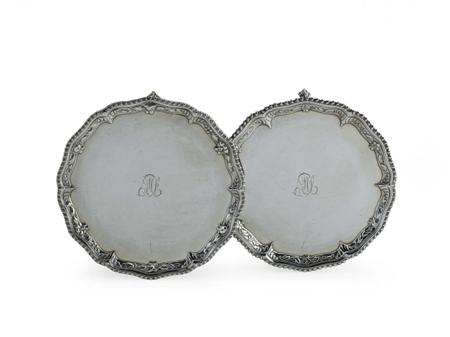 Appraisal: A matched pair of early George III small circular salvers